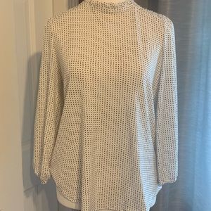 Medium polka dot long sleeve top. Stretchy material